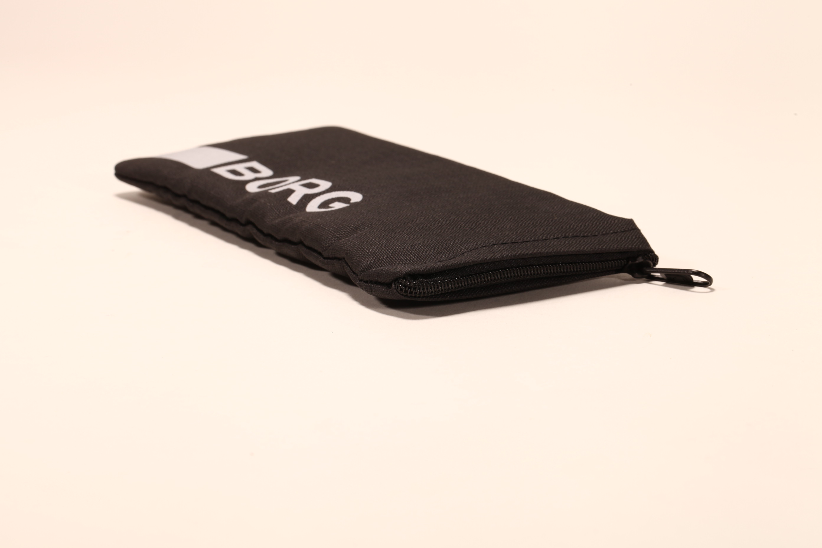 A zippered eyewear bag made of polyester fabric that can hold all kinds of small objects