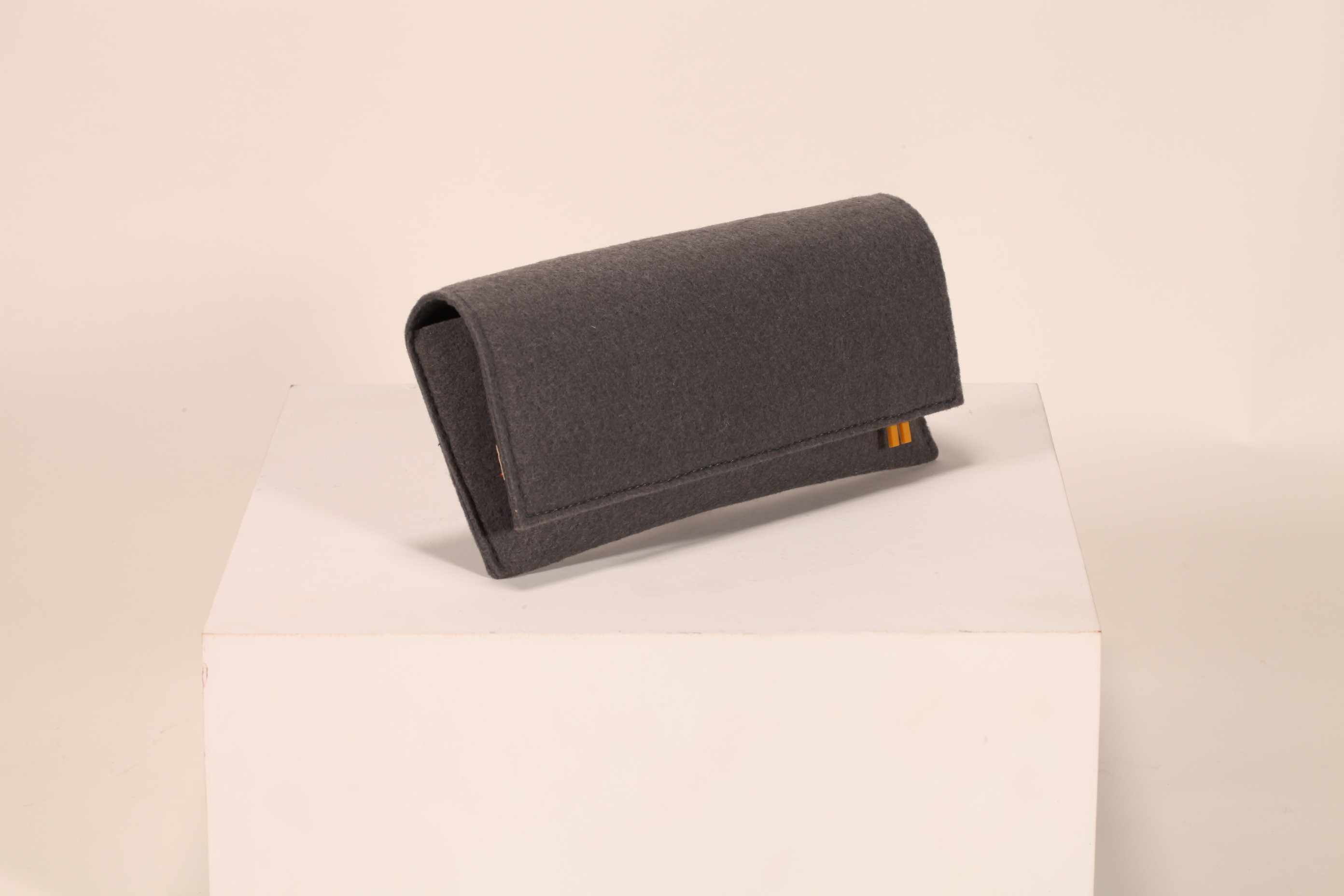 A felt material of gray glasses case soft bag, fine sewing line,
