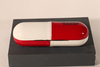 A pill-like eyeglasses case printed with CONAN LOGO, with a novel design, small and cute