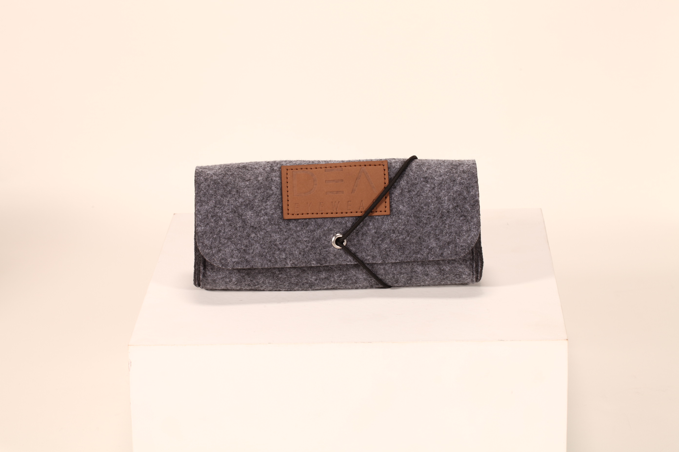 A felt glasses case soft bag, with an elastic rope to hold, the design is very clever