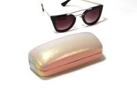 Stylish, brightly colored glasses in tin boxes,