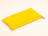A solid yellow zipper bag that can hold all kinds of small items,
