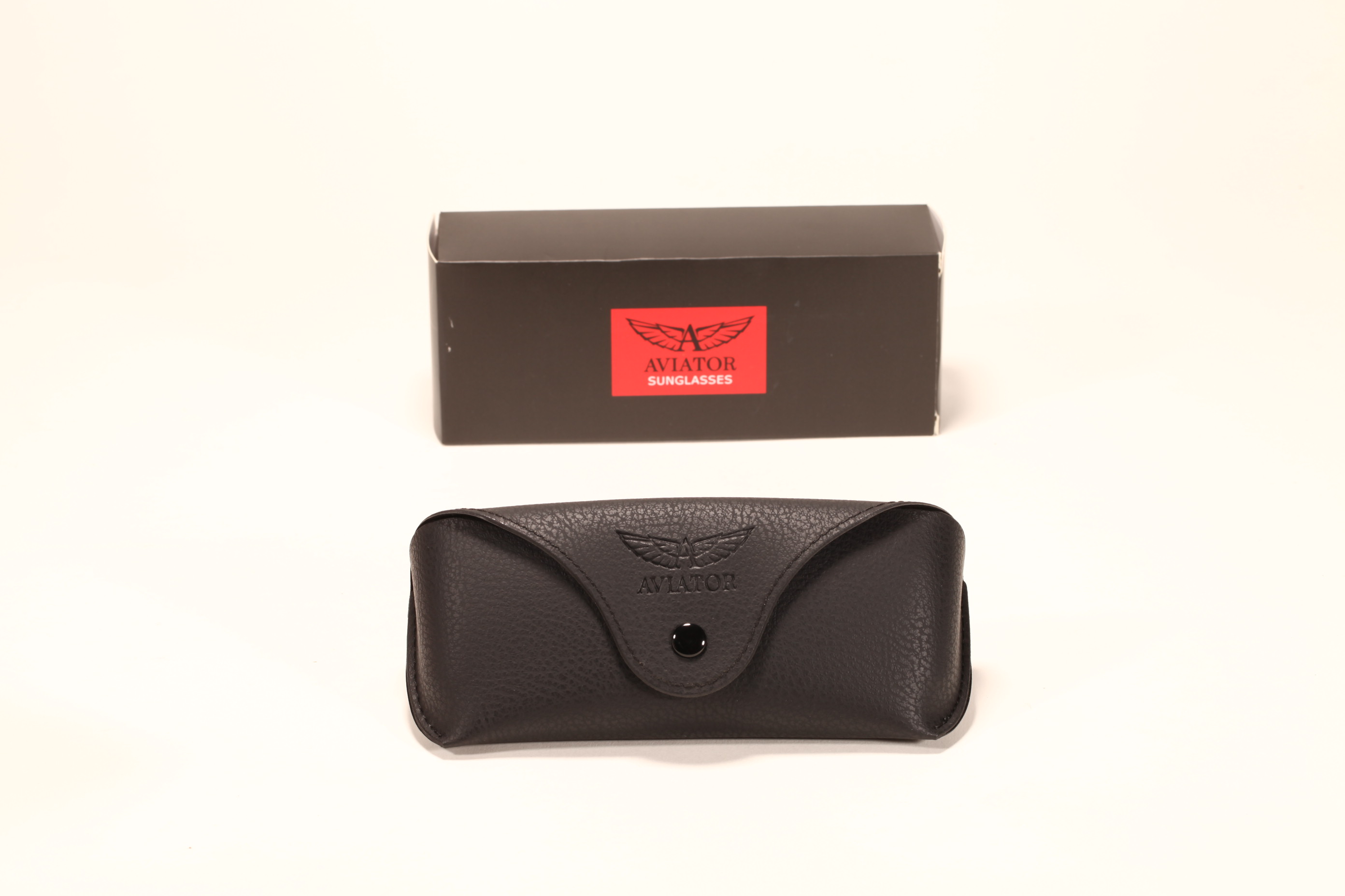 A black glasses case set, including a carton and a soft case