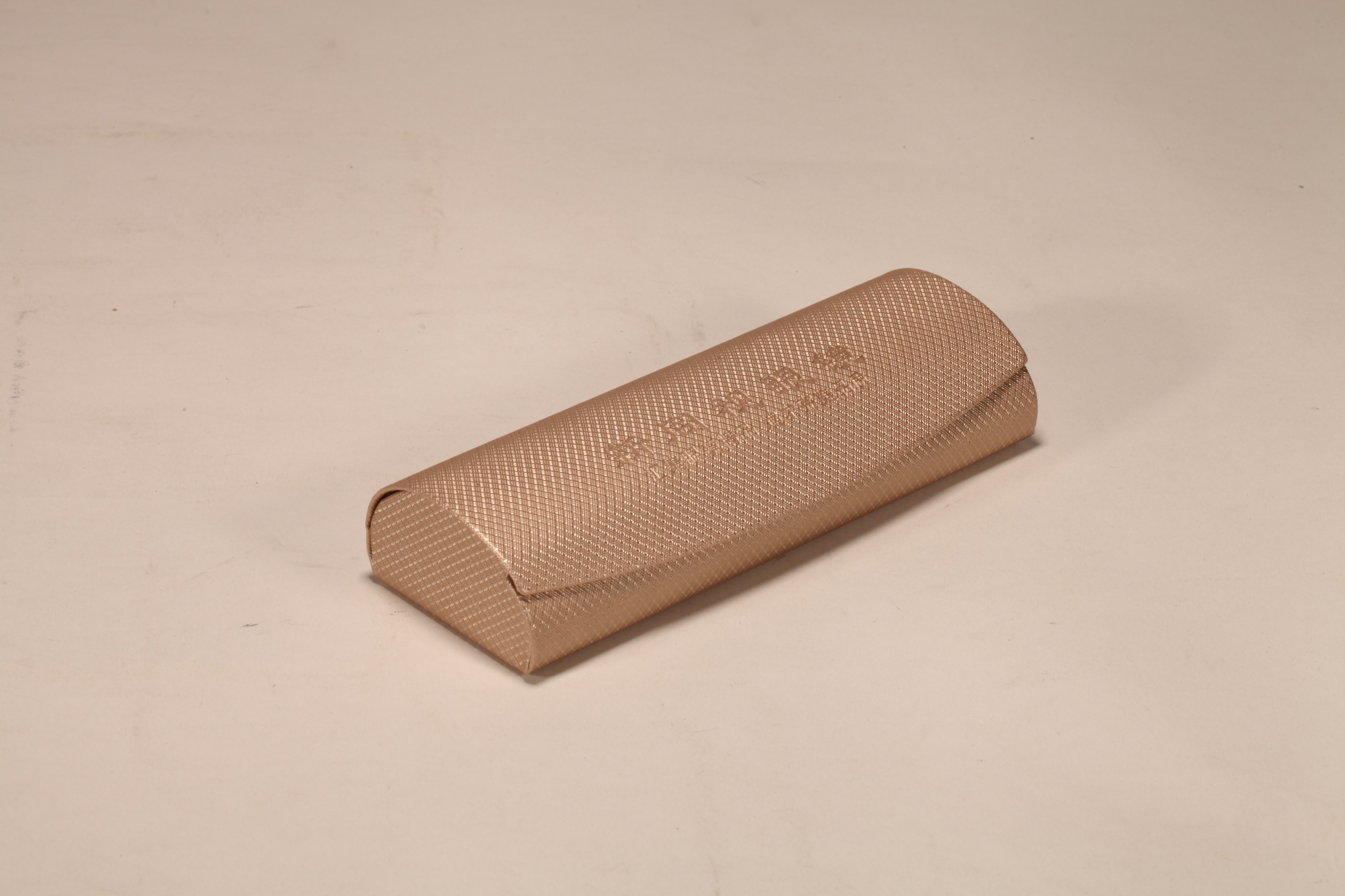 A brown-gold hand-made glasses case printed with Chinese LOGO, made of canary