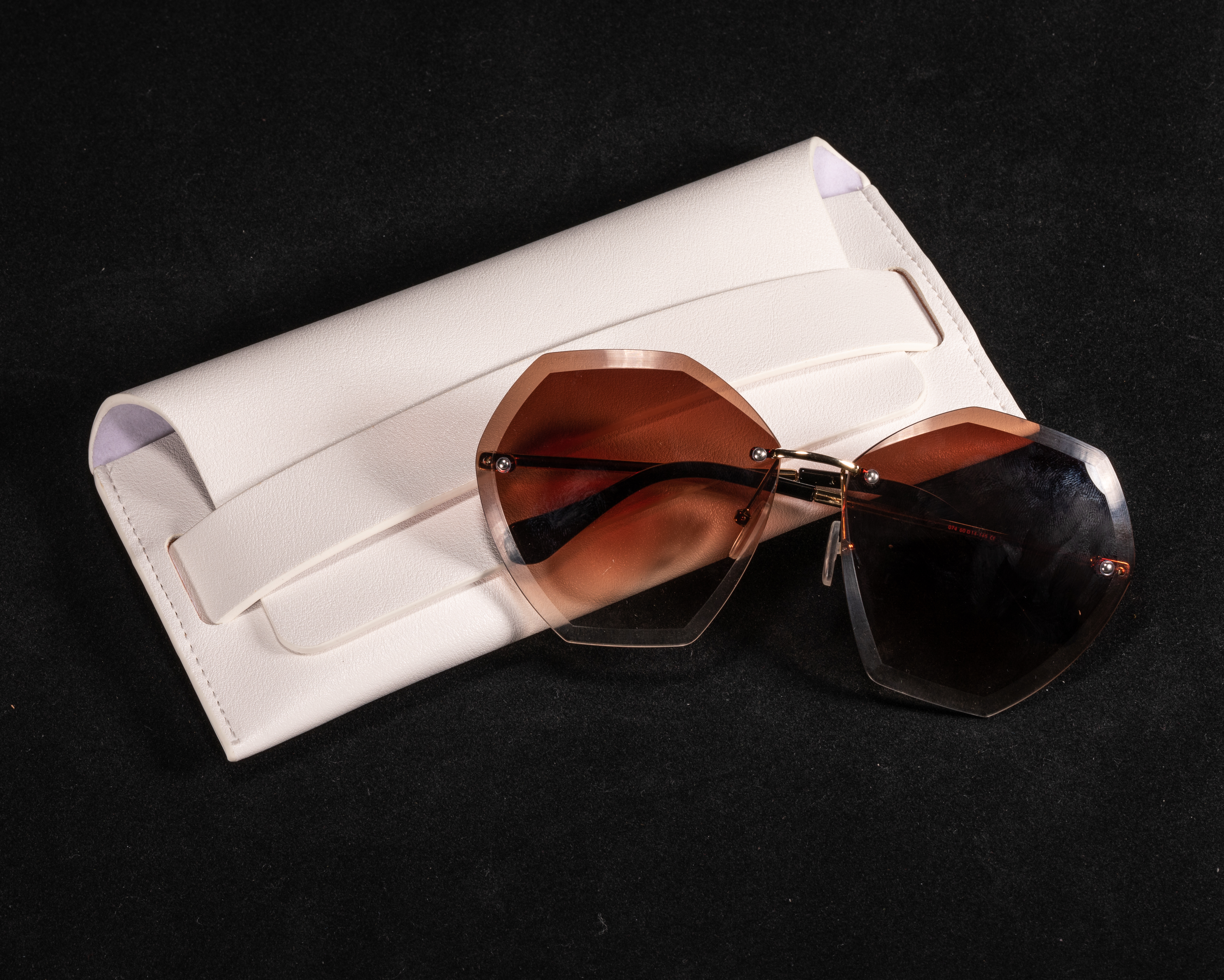 A White, Pocketed Eyeglass Case Shaped Like A Leather Bag