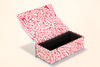 This eyewear case set includes a red and white patterned box, a blue pouch, and other accessories.