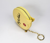 A Small Leather Bag in Drab Yellow, Round, And Printed with A LOGO in 2021. It Is Extremely Cute, Small, And Exquisite
