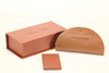 This Valoré eyewear set features a pink box, a tan semi-circular leather case (with gold snap), and a small square card. It exhibits elegant minimalist design, premium texture, and consistent branding