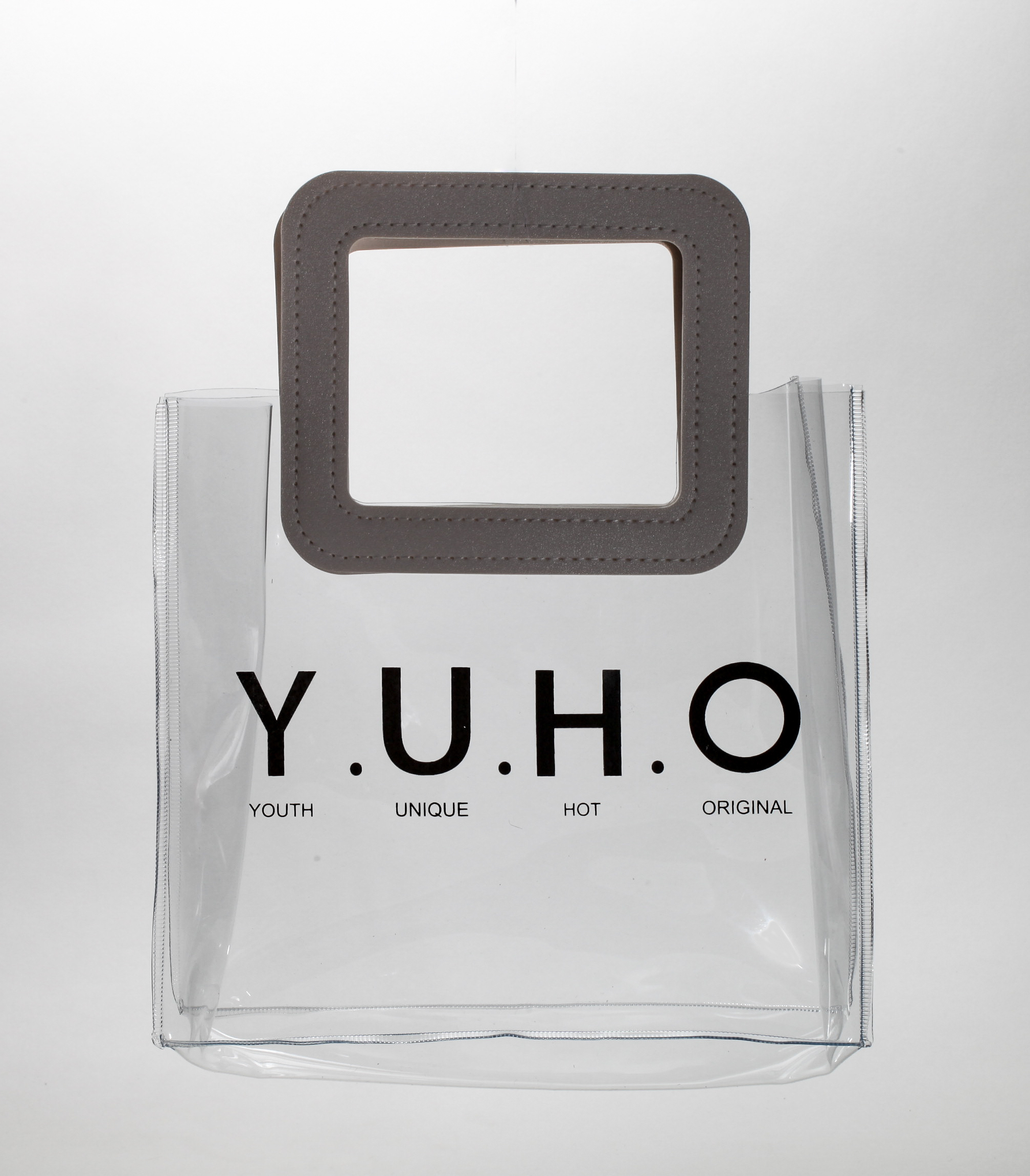 Three translucent bags in green, pink, and blue feature white square handles. The front displays the black text "MARMOTT EYEWEAR".