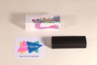 Here's a 50-word English description for the eyewear set shown in the image: This Optique eyewear set includes a white paper box and a soft matching pouch. Featuring the tagline "ENJOY YOUR EYEWEAR" 