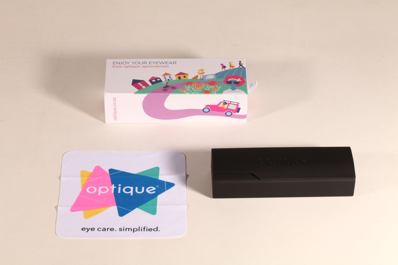 Here's a 50-word English description for the eyewear set shown in the image: This Optique eyewear set includes a white paper box and a soft matching pouch. Featuring the tagline "ENJOY YOUR EYEWEAR" 