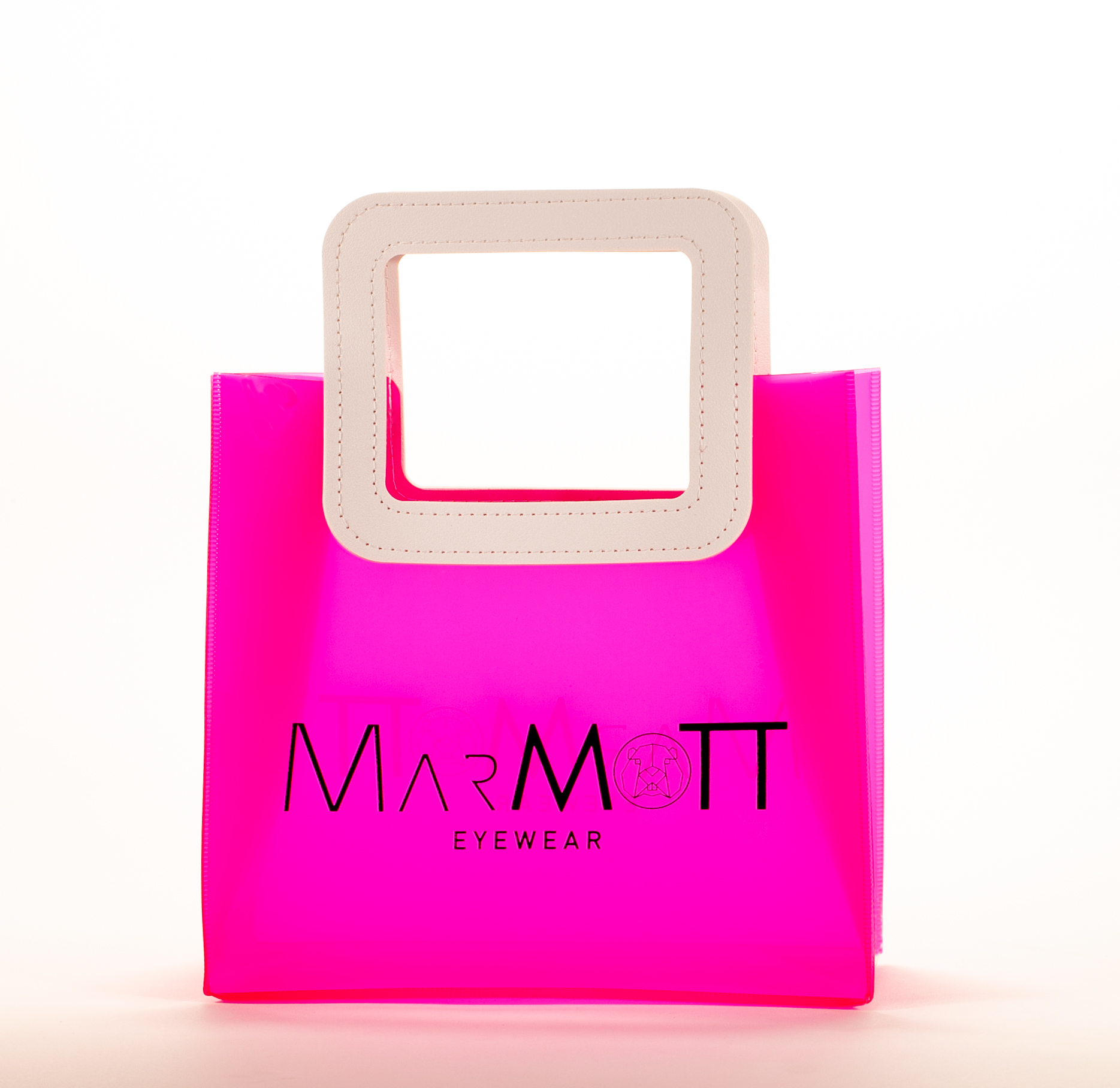 Three translucent bags in green, pink, and blue feature white square handles. The front displays the black text "MARMOTT EYEWEAR".