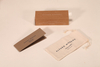 Here's a 30-word English description for the eyewear set shown in the image: This Alvaro Moreno eyewear set includes a navy paper box and a matching foldable case. Compact at 15.5×6×4 cm. Elegant and